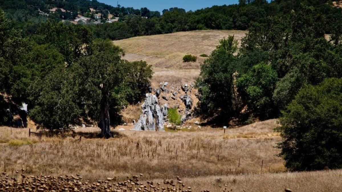 Looking north toward a former quarry with a 25-foot tall obelisk known as The Monolith, believed to be used as a post and cable feature to extract lime from the quarry on the proposed Marble Valley development site, a former limestone mine in El Dorado County on Wednesday August 7, 2013. Parker Development Company, builder of the vast Serrano El Dorado community, is readying plans for its proposed 3,236-home Marble Valley Village amid former limestone mines, oaks and a vast lagoon south of Highway 50.