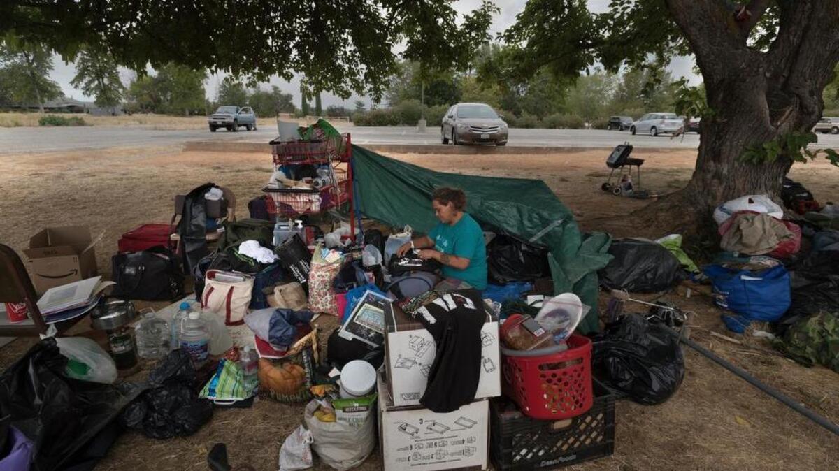 Jamie Brody, 37, packs her belongings at a popular transient encampment in Auburn in 2015. Amid a growing homeless population, the Placer County Board of Supervisors has approved the purchase of a hotel in Kings Beach to house the homeless.