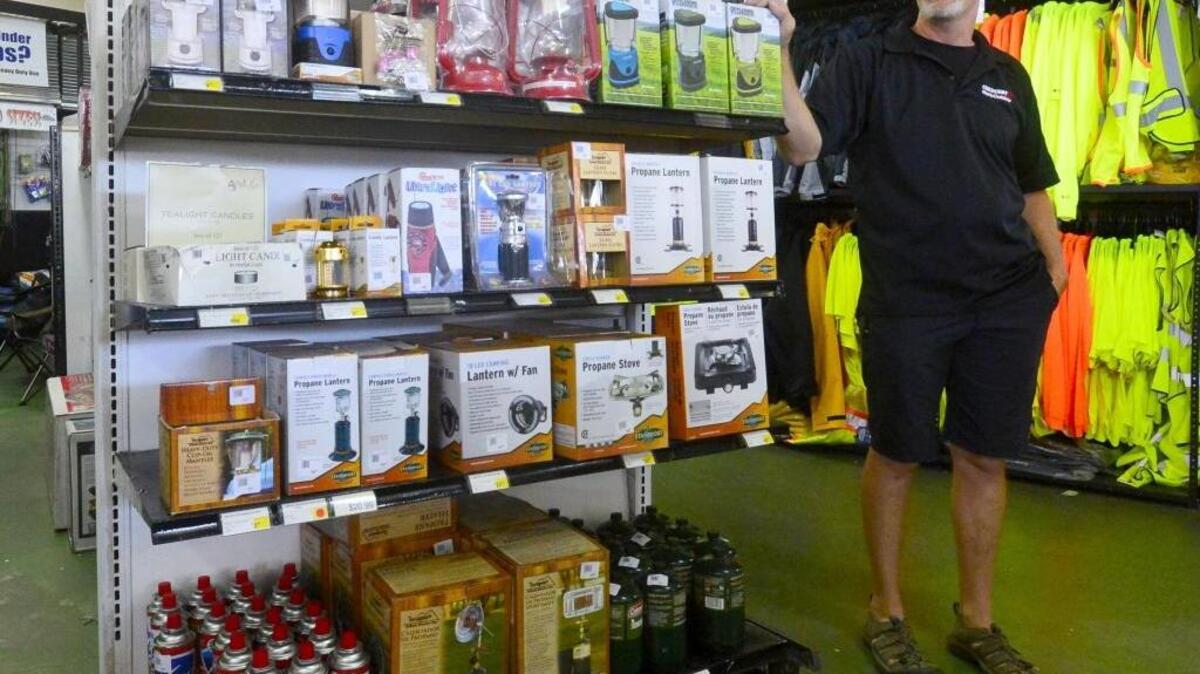 Craig Stott, owner of Crescent Work and Outdoor, stands by camping equipment at the Crescent Work and Outdoor store in Modesto California on June 13, 2016.