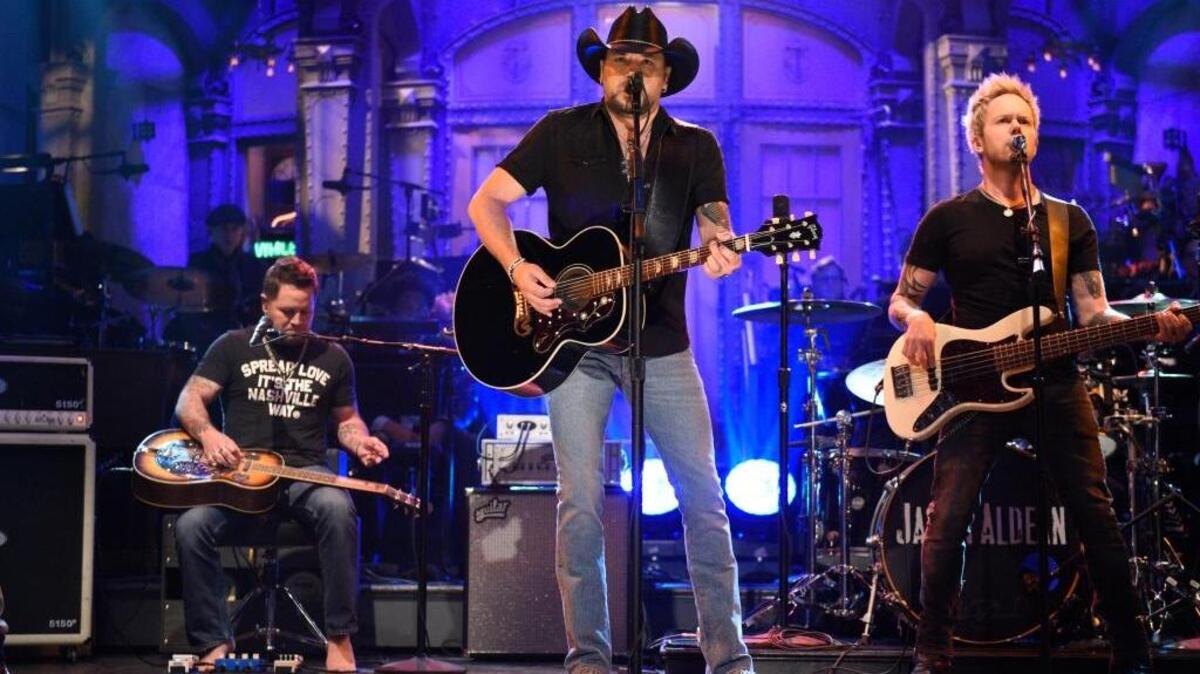 Jason Aldean performs the Tom Petty hit “I Won’t Back Down” on “Saturday Night Live” on Saturday in New York. The show paid tribute to the victims of last Sunday’s shooting massacre in Las Vegas, where Aldean was performing, and also to Petty, the Hall of Fame musician who died Monday.