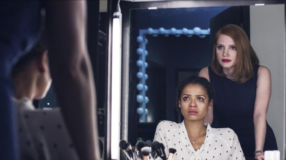 Gugu Mbatha-Raw, left, plays Esme, mentored by high-powered Washington lobbyist Elizabeth Sloane (Jessica Chastain) in “Miss Sloane.”