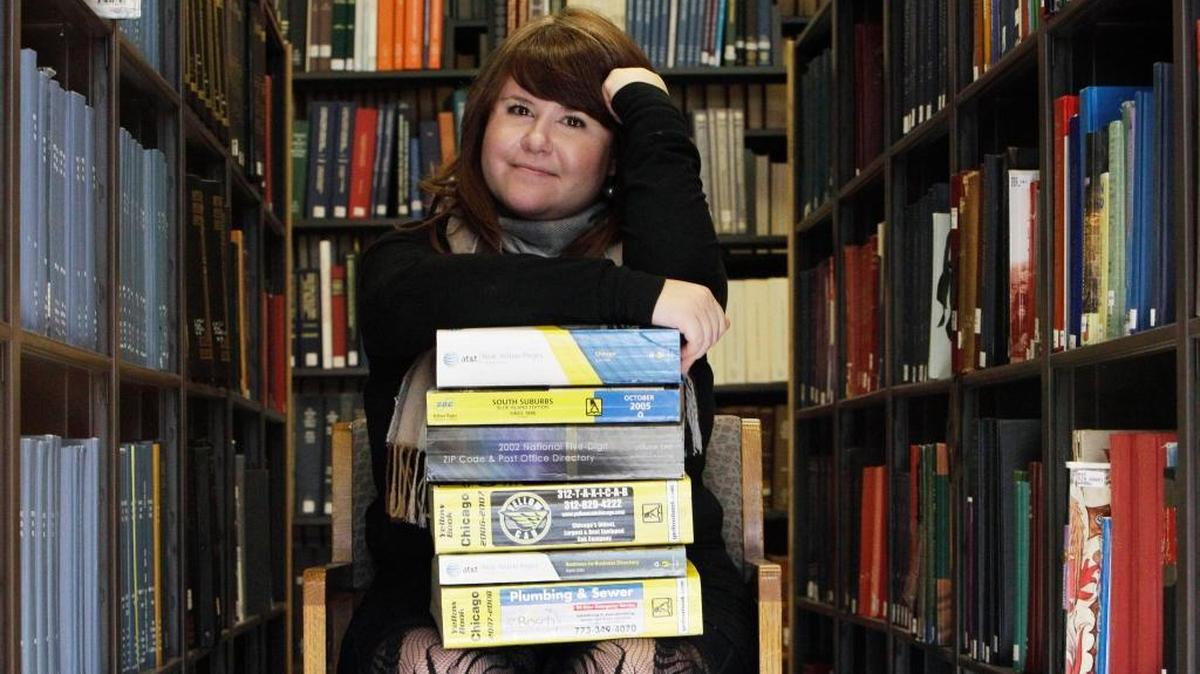 This photo taken Nov. 9, 2010, shows Emily Goodmann, a doctoral student who is doing her dissertation on the history of the telephone book. Ancestry, with the help of the white pages, researched the most common surnames in each state.
