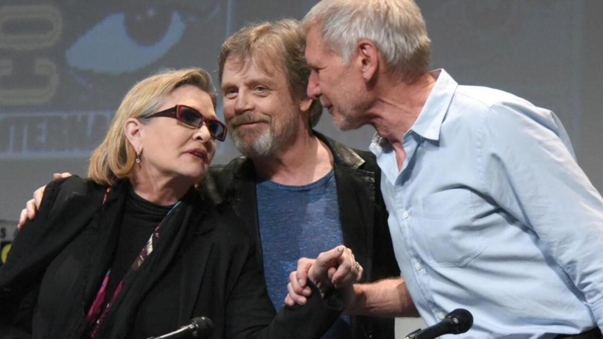Mark Hamill, center, appears with “Star Wars” co-stars Carrie Fisher, left, and Harrison Ford in San Diego at Comic-Con International in 2015. Hamill, who lived in San Diego for four years as a youth, had a street dedicated in his honor Sunday.