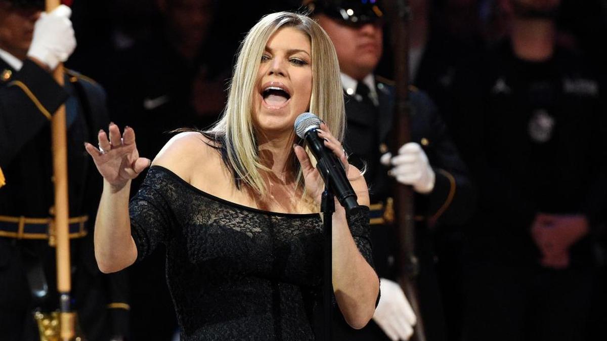 Singer Fergie performs the national anthem prior to the NBA All-Star Game on Sunday in Los Angeles.