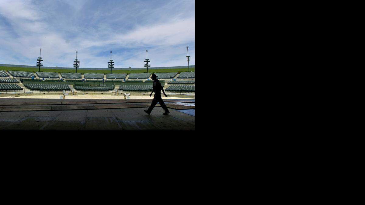 
A stagehand wanders across the stage of the Sleep Train Amphitheatre near Marysville on May 6, 2004. The 18,500-capacity venue is the largest concert facility in the Sacramento area, and will begin its summer concert season on May 23.
