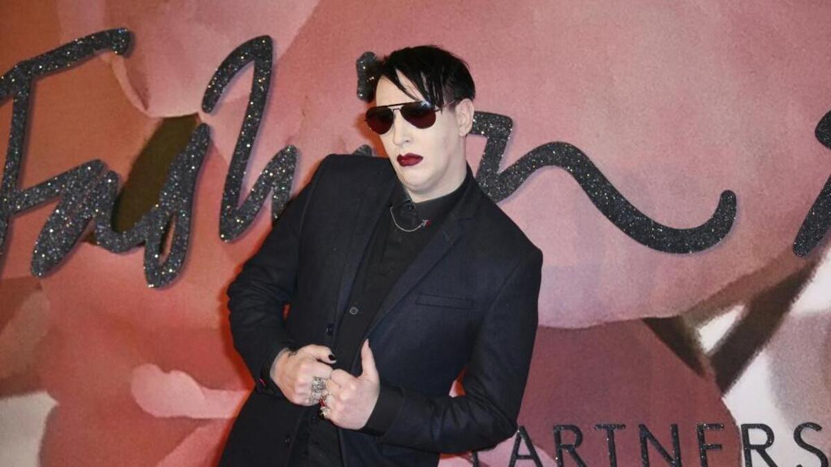 Musician Marilyn Manson arrives at the Fashion Awards in London on Dec. 5, 2016. Manson has canceled his appearance at Aftershock, the two-day music festival later this month in Sacramento.