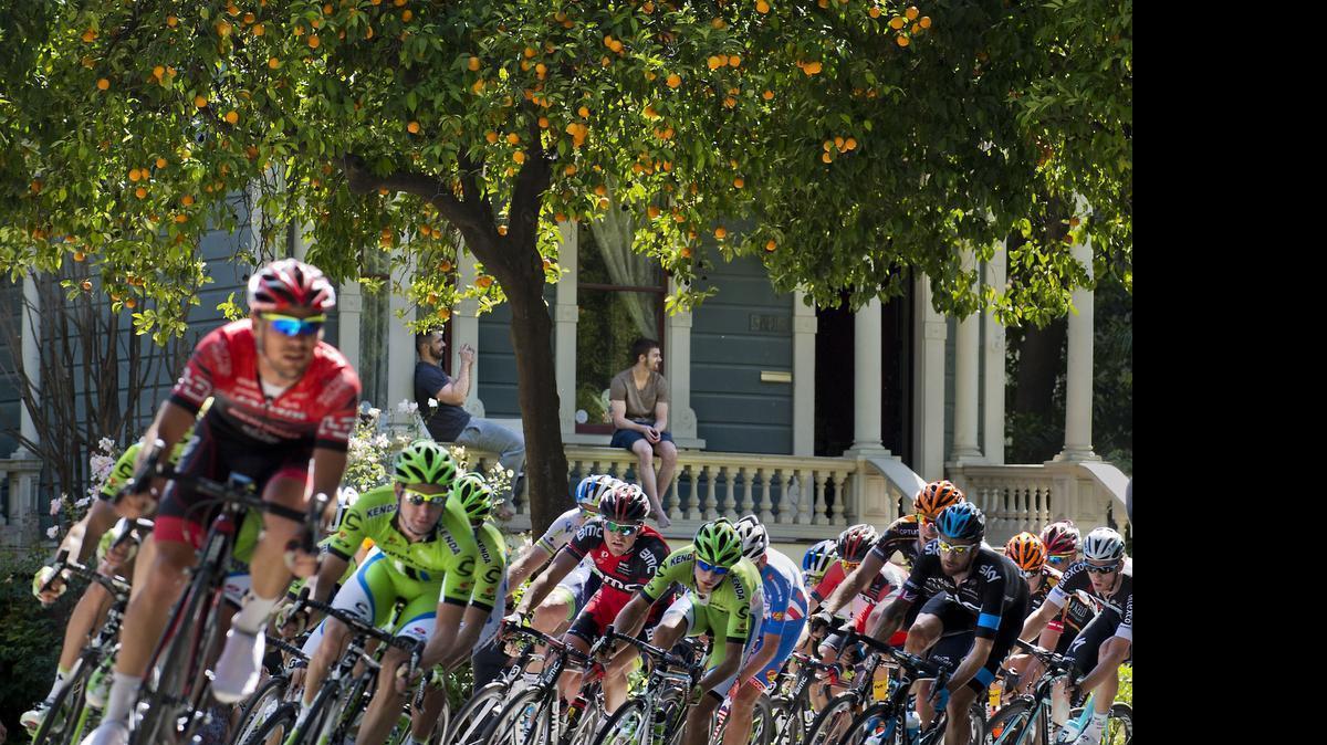 
The peloton sweeps around the corner from P Street onto 18th Street during stage 1 of the Amgen Tour of California cycling event in Sacramento in 2014.

