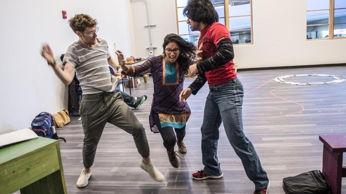 A pivotal scene where the teacher breaks up a fight in the musical Gandhi! is rehearsed by Hunter Henrickson, left, Meetu Chilana, center, and Danis Farooqui, right, at The Sofia theatre last week in Sacramento.