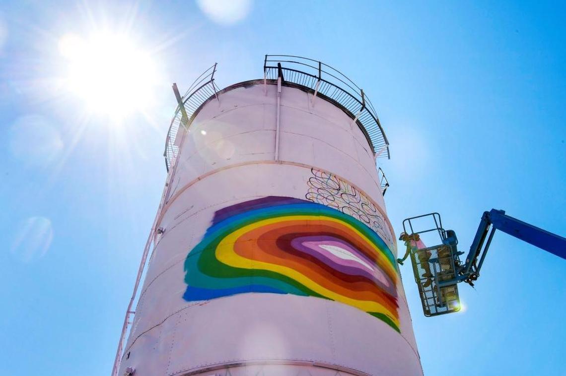 Muralist Okuda San Miguel paints a mural on the side of a metal silo on Third Street just south of Broadway in Sacramento on Tuesday, Aug. 8, 2017.