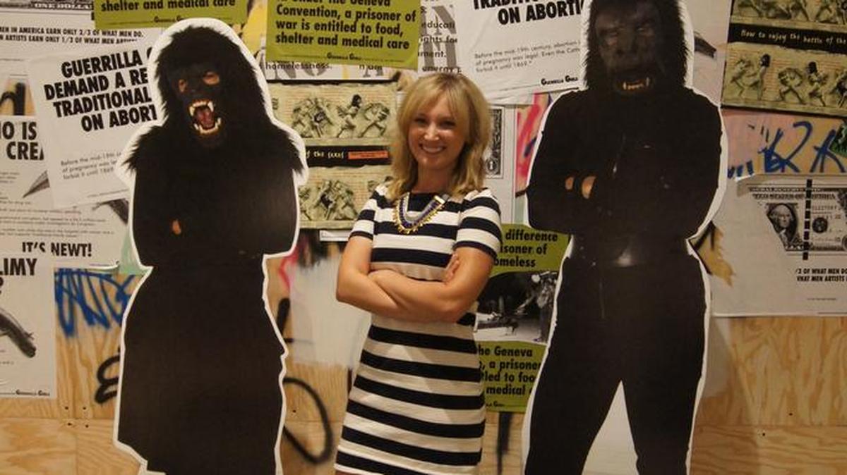 Ann Andreazzi, from Verge Center for the Arts, poses with life-sized cut-outs of Guerrilla Girls Frida Kahlo and Kathe Kollwitz for the exhibit “Not Ready to Make Nice.”
