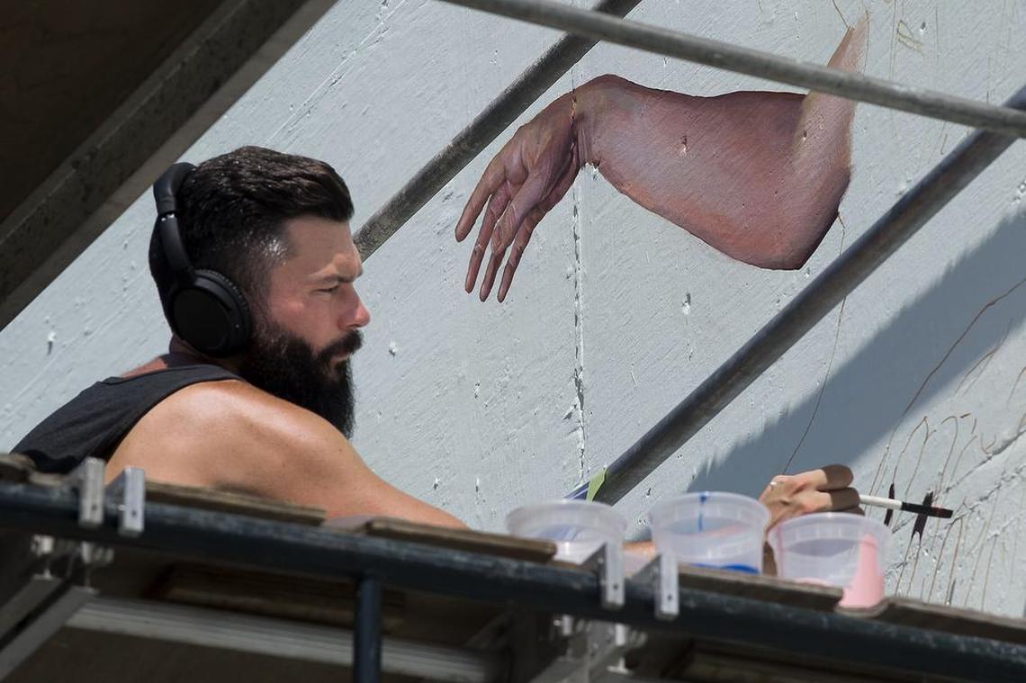 Mural artist Nate Frizzell works on a mural at 2000 K Street in Sacramento on Aug. 20 2016, for the Sacramento Mural Festival.