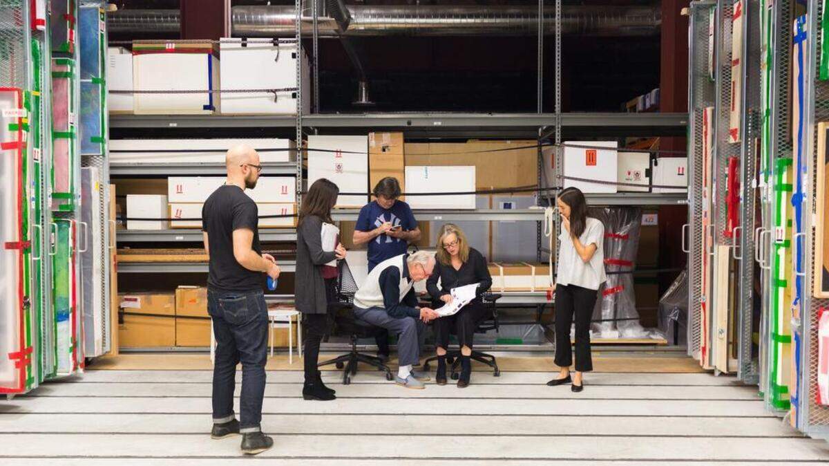 Wayne Thiebaud works with associates and museum staff – including curator Janet Bishop, sitting at center – to select art for a show opening Saturday at the San Francisco Museum of Modern Art.