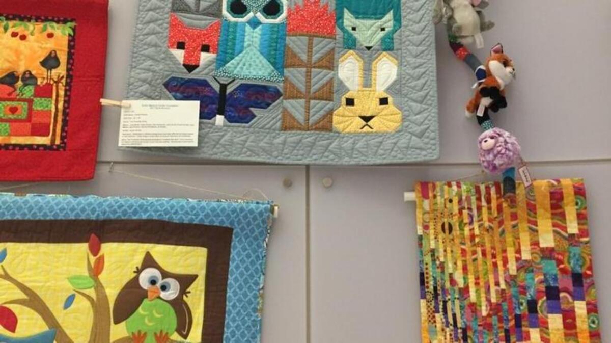Quilts on display at the Sutter Cancer Center building in advance of the Nov. 4 Sutter Breast Cancer Quilt Auction