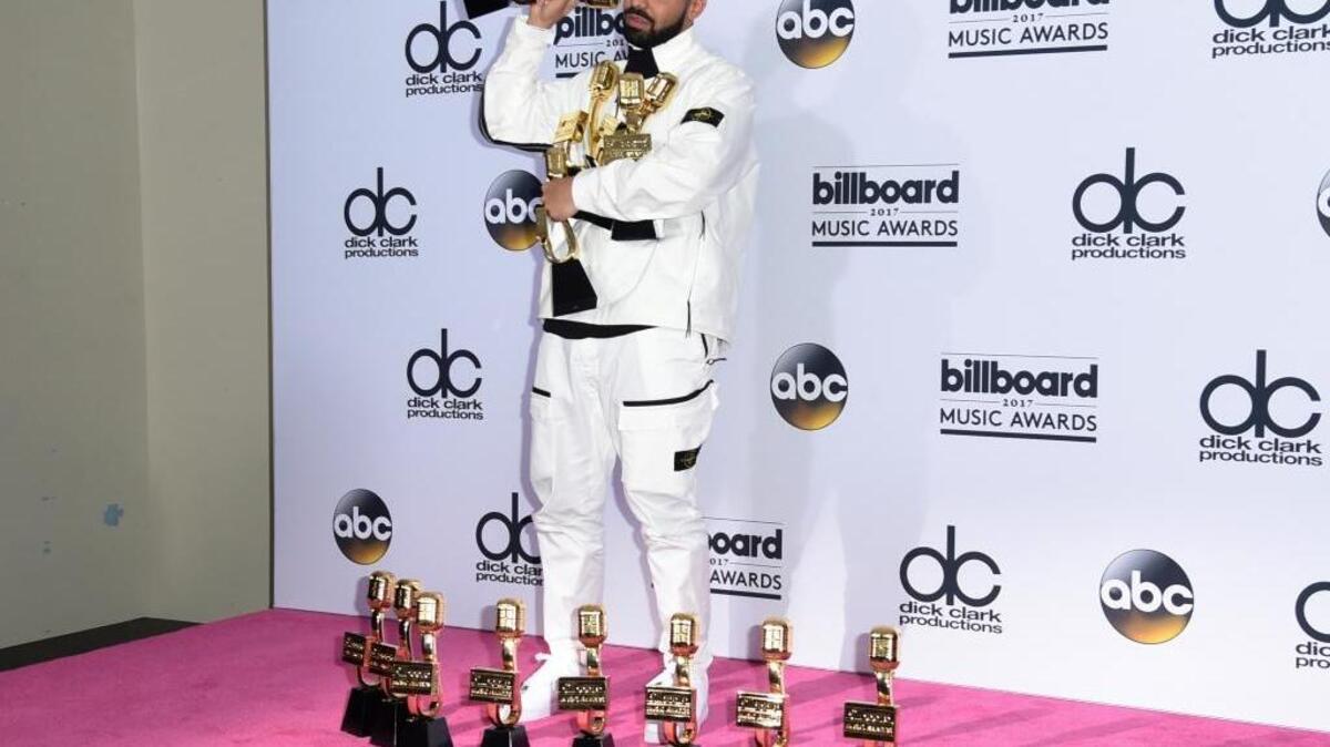 Canadian rap artist Drake poses in the press room with his 13 awards at the Billboard Music Awards at the T-Mobile Arena on Sunday in Las Vegas.