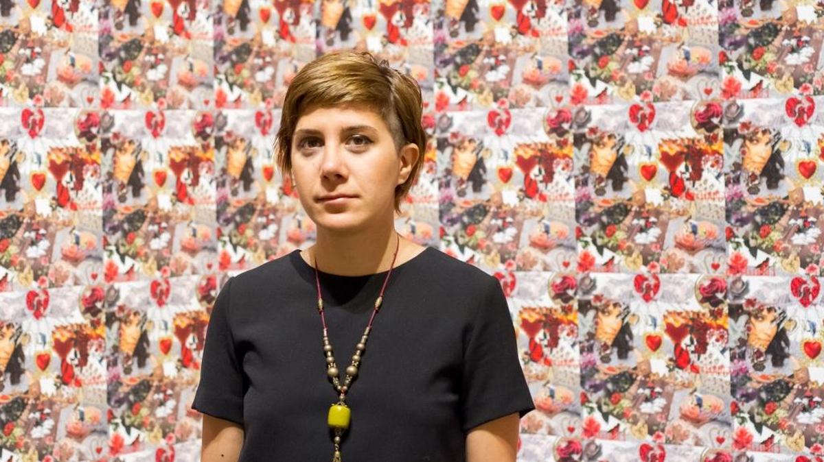Morehshin Allahyari stands with her creation titled “Like Pearls.” It refers to an Iranian saying that a woman in a hijab or chador is like a hidden pearl.