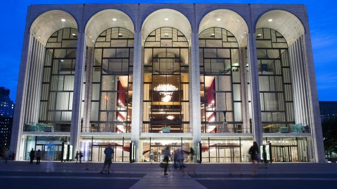 In this Aug. 1, 2014, file photo, pedestrians make their way in front of the Metropolitan Opera house at New York's Lincoln Center.