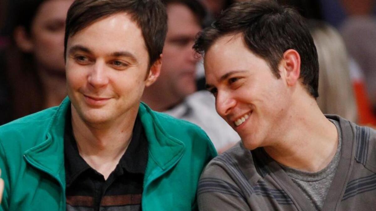 Actor Jim Parsons, left, and Todd Spiewak attend an NBA game in March 2012. The two were married Saturday. They’ve been together for more than 14 years.