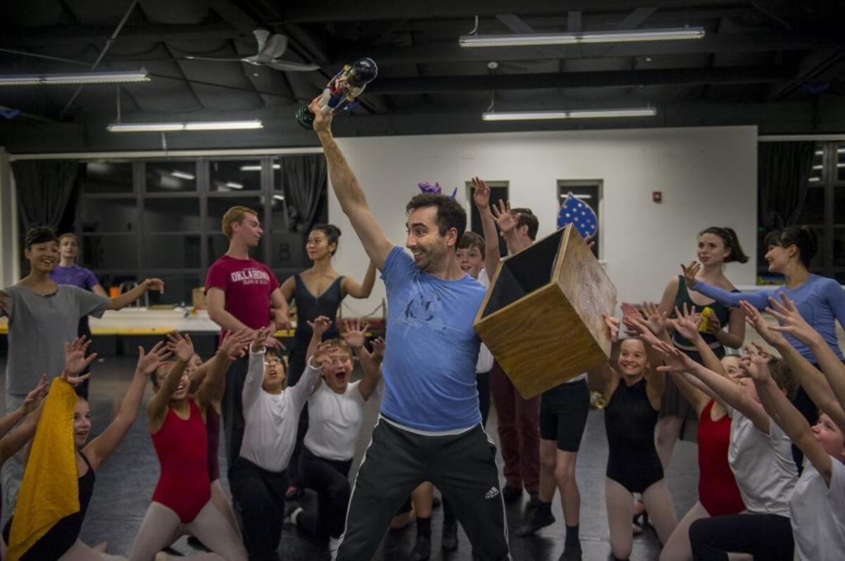 Christopher Nachtrab of the Sacramento Ballet raises a figure of a nutcracker during rehearsal of “The Nutcracker” on Wednesday.