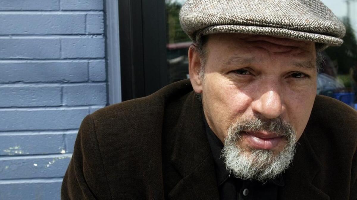 Pulitzer Prize-winning playwright August Wilson shown in his Seattle neighborhood in 2003, two years before his death at age 60.