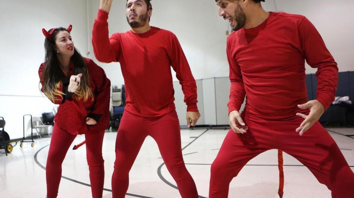 The bilingual musical “La Pastorela de Sactown” features, from left, Shannon Van Der Mersch, Carlos Kandia and Rueben Rivera, shown during a rehearsal earlier this month.