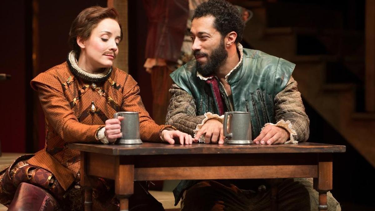 Disguised as a male actor, Viola (Jamie Ann Romero) sneaks a moment of tenderness with Will (William DeMeritt) in an Oregon Shakespeare Festival production of “Shakespeare in Love.”