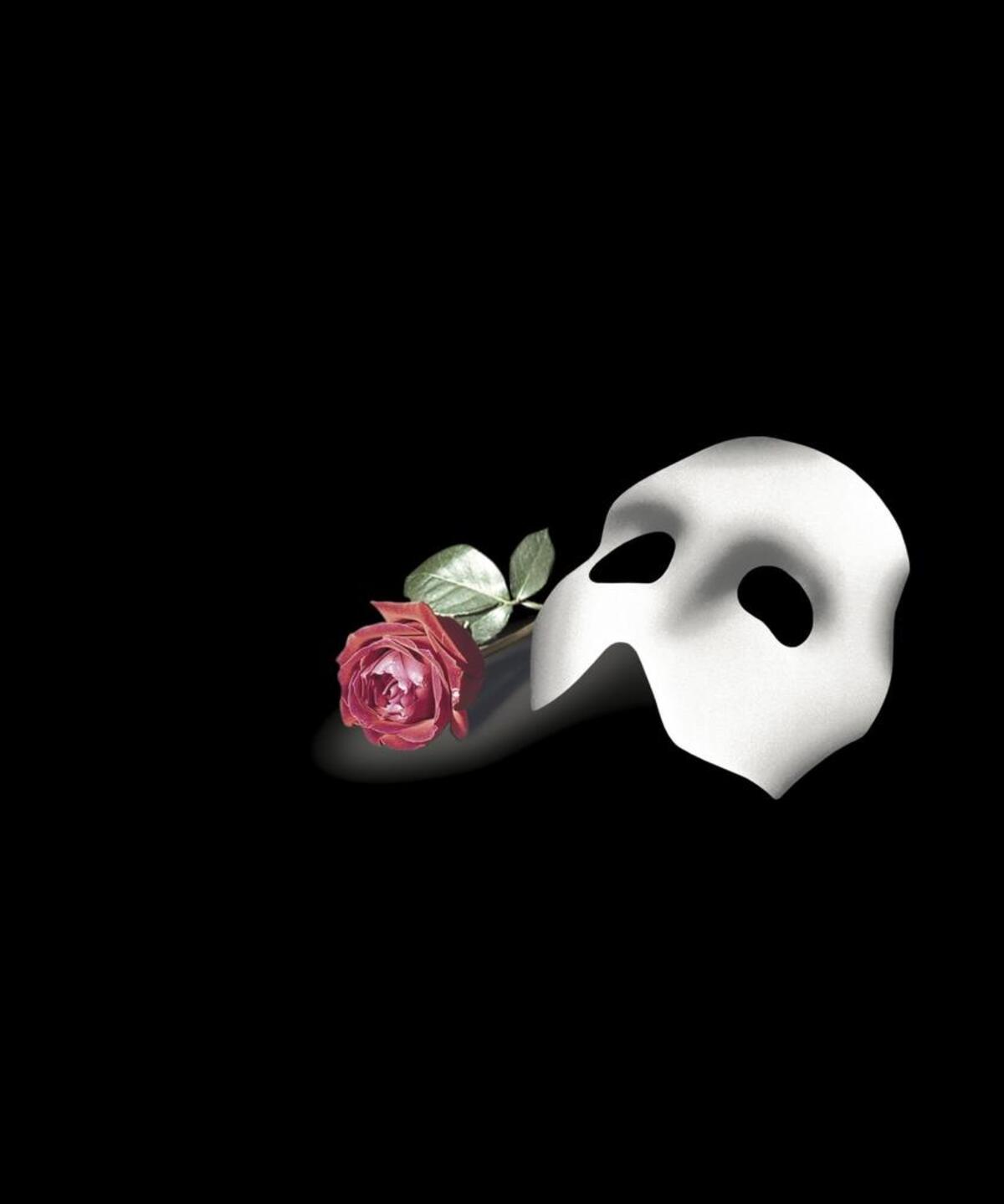 The Phantom of the Opera, mask and rose. It comes to Sacramento on Wednesday, May 17.