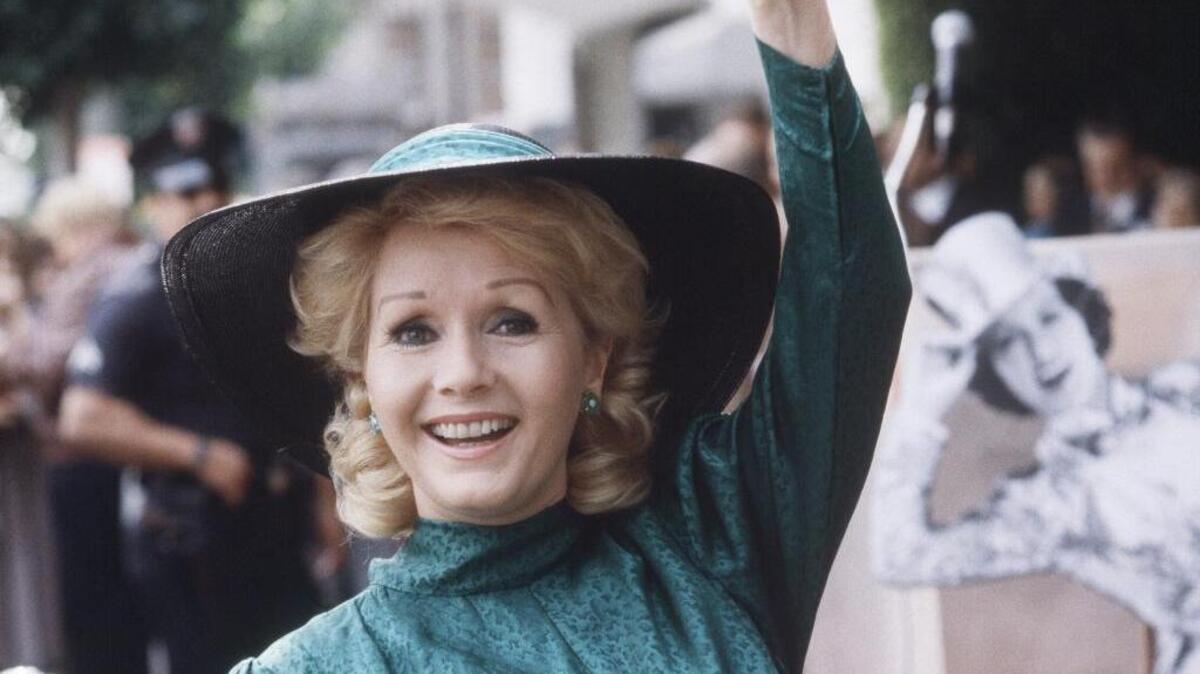In this 1984 file photo, actress Debbie Reynolds appears at Hollywood Walk of Fame ceremonies in Los Angeles. Reynolds died Wednesday, Dec. 28, 2016. She was 84.