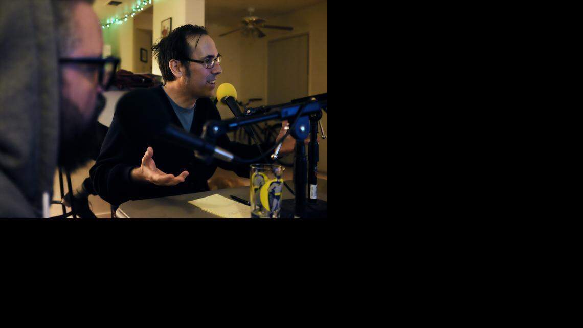 
Fellow host Johnny Taylor, left, listens to Keith Lowell Jensen during a recording session for the Sacramento podcast “It’s Funny Because” late last month. 
