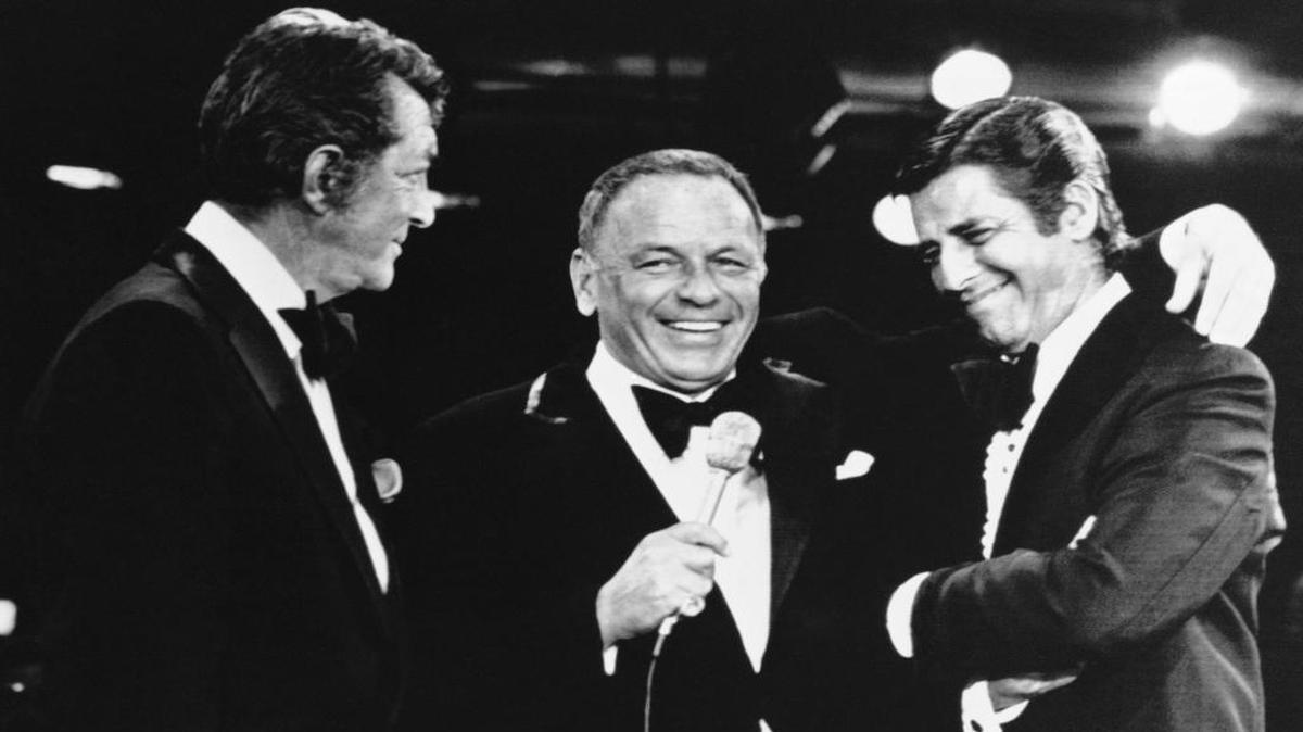 Frank Sinatra, center, appearing as a performer on the annual Muscular Dystrophy telethon hosted by Jerry Lewis, right, brings on Dean Martin, Lewis old partner, to the surprise of Lewis, in Las Vegas. It was the first time Martin and Lewis had appeared together since their comedy team broke up 20 years before. Lewis, the comedian and director whose fundraising telethons became as famous as his hit movies, died Sunday, Aug. 20, 2017, in Las Vegas, according to his publicist. He was 91.