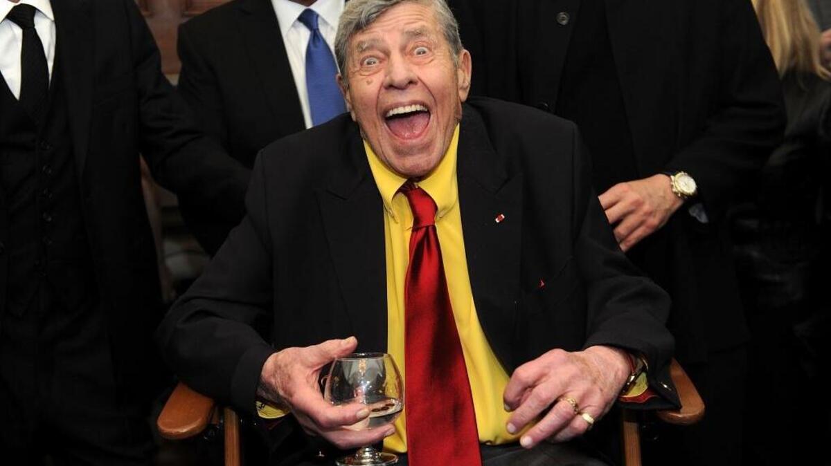 Jerry Lewis interacts with the press at the Friars Club before his 90th birthday celebration in New York in 2016. Lewis, the comedian and director whose fundraising telethons became as famous as his hit movies, died Sunday. He was 91.