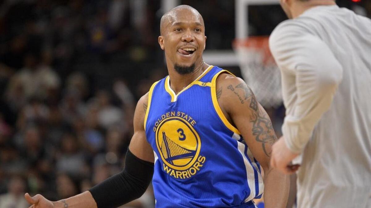 FILE - In this March 29, 2017 file photo, Golden State Warriors forward David West reacts to the win after an NBA basketball game against the San Antonio Spurs in San Antonio. West’s wife, Lesley, organized a prom dress giveaway held at Oakland High School on Saturday, April 29, 2017.