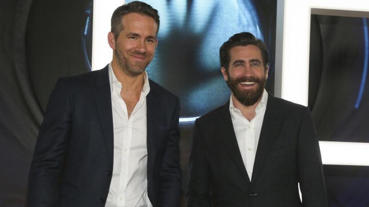 Ryan Reynolds, left, and Jake Gyllenhaal arrive for the premiere of “Life” at the South by Southwest festival.