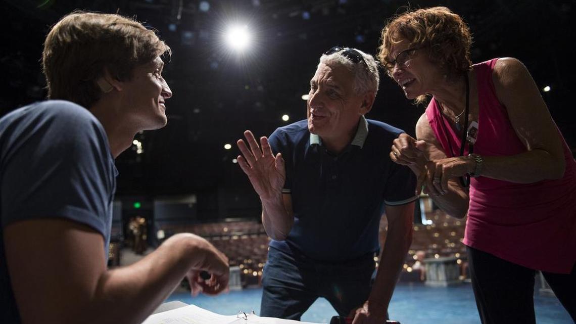 Artistic director Glenn Casale instructs deaf actor John McGinty, who is playing Quasimodo, with the aid of sign language interpreter Tracy Brennan, during a rehearsal for “The Hunchback of Notre Dame.”