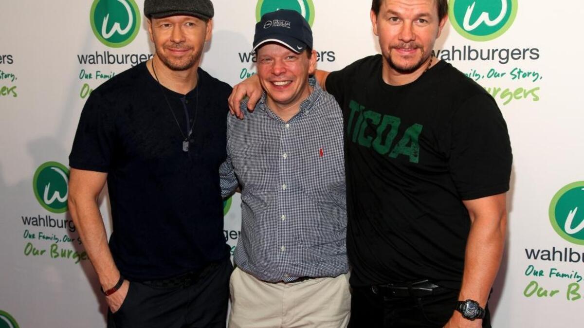 Donnie Wahlberg, from left, Paul Wahlberg and Mark Wahlberg attend the Wahlburgers Coney Island preview party on Tuesday, June 23, 2015, in New York.