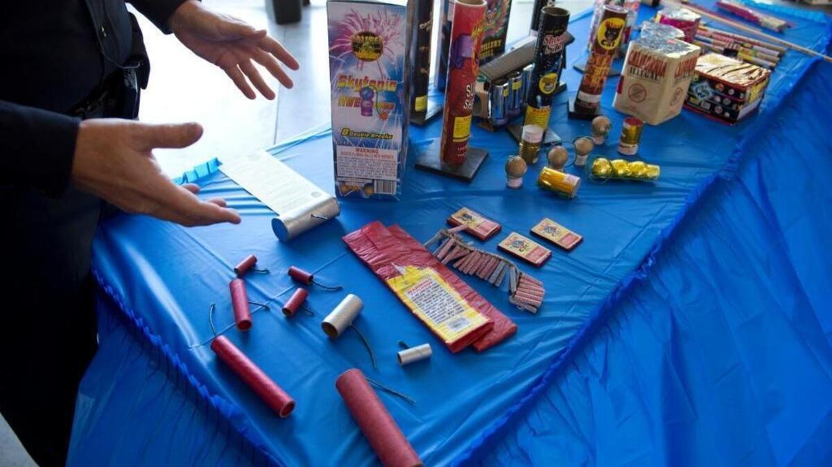 Sacramento police Sgt. Mark Harri shows illegal fireworks during a press conference at city Fire Station 19 in Sacramento on June 26, 2013.