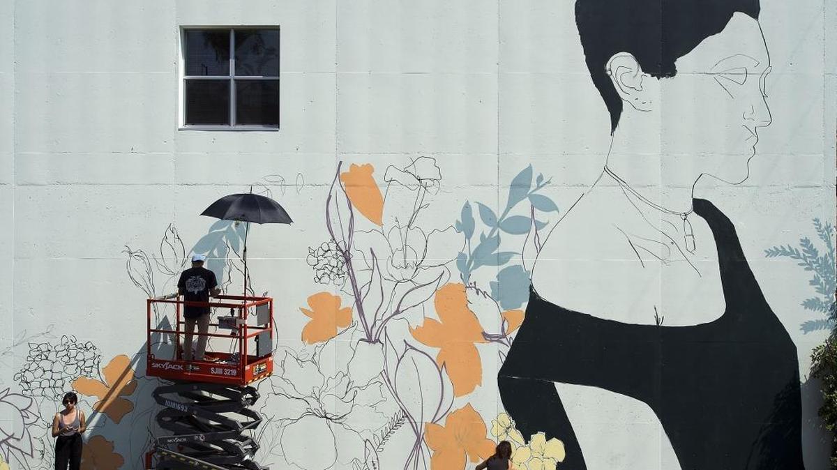 Painters work on a mural at 2000 K Street in Sacramento on Aug. 20, 2016. A group of artists worked on a series of murals in downtown and midtown as part of Sacramento Mural Fest. It was one of the city’s notable arts-and-culture events of the year.
