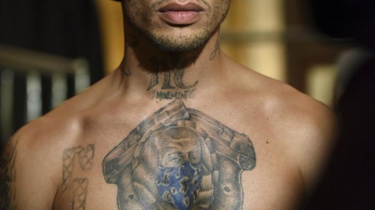 Meeks, who became an internet sensation after his mugshot went viral following his arrest, poses at the Philip Plein show.