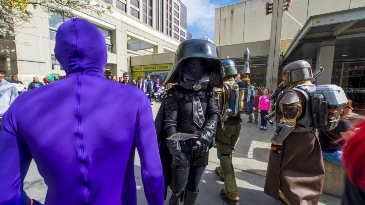 Convention goers walk around outside the Wizard World Sacramento Comic Con held at the Sacramento Convention Center in 2014.