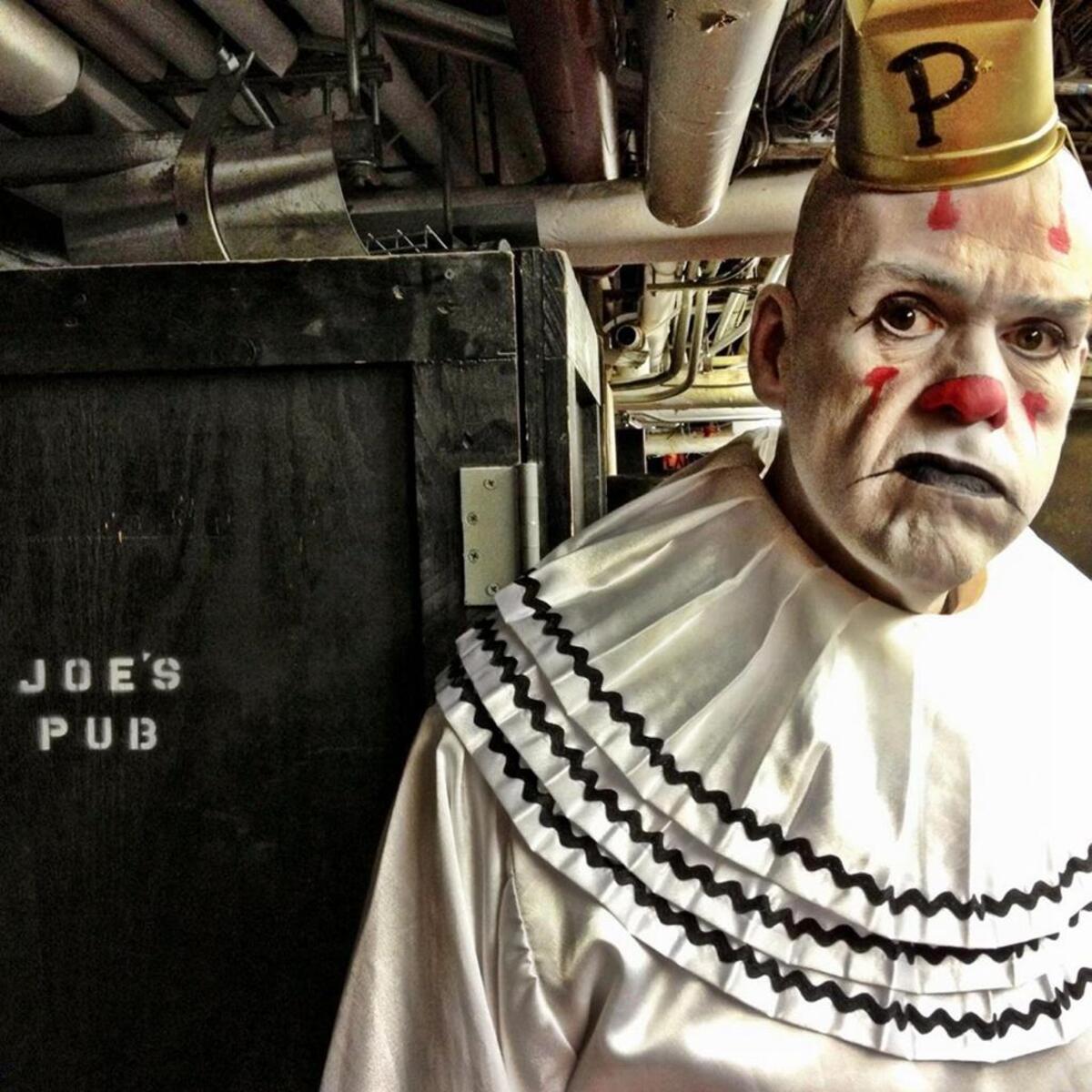 Big Mike Geier (6-foot-8) is Puddles, the melancholy clown with the sad face and soaring vocals.