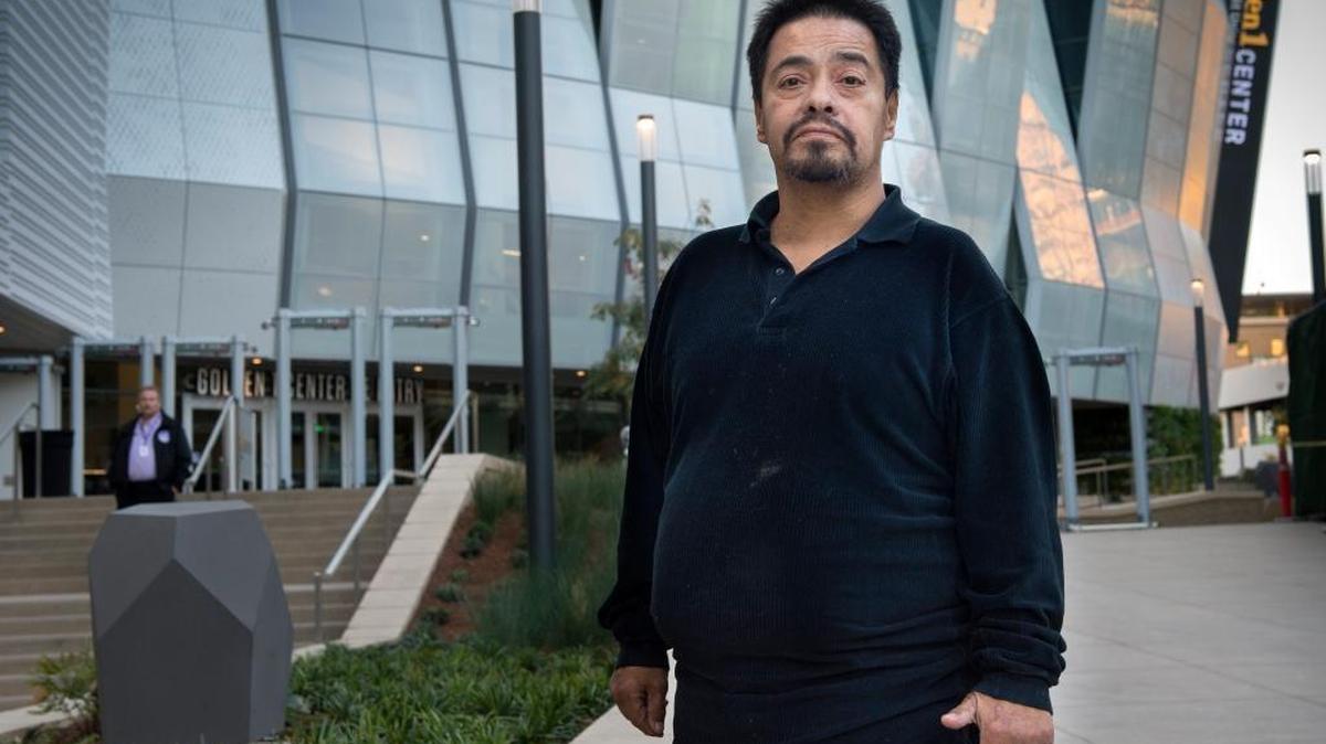 Ruben Molina, has been a Sacramento Kings fan since he moved to Sacramento in 1985, but has never been able to see them live, especially after he lost his diabetic right foot. He stands in front of the new Golden 1 Center in Sacramento.