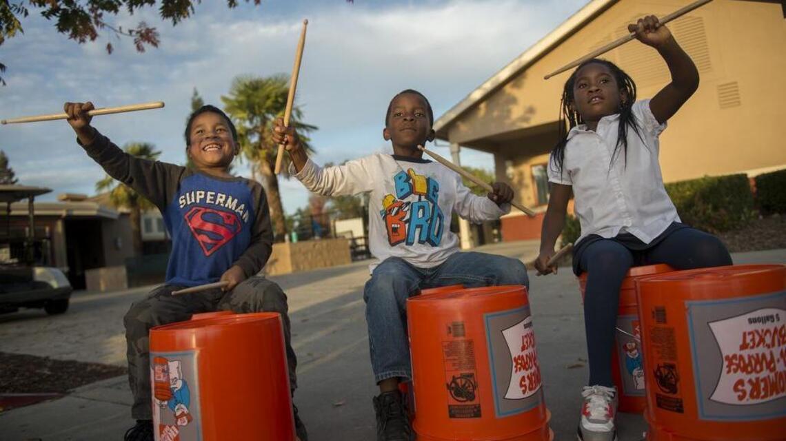 Young musicians have bucketfuls of enthusiasm, no drums