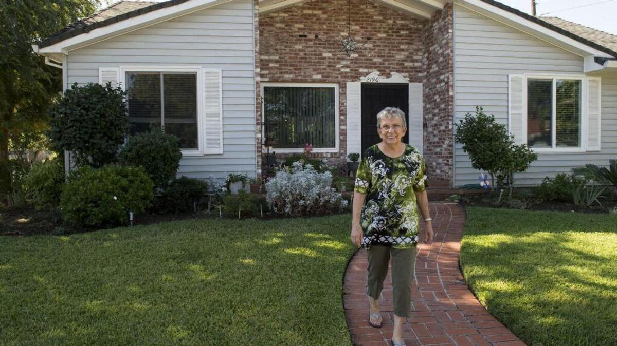 Home owner Doreen Snyder showed off her front yard in the Golf Course Terrace neighborhood on Wed., Sept. 28, 2016 in Sacramento, Calif. The Golf Course Terrace is about to get its first home & garden tour, celebrating its mid-century modern houses and mature shady trees.