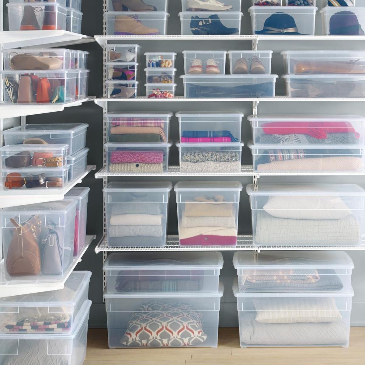 Plastic boxes from Elfa at The Container Store transform a closet into a neat and moth-proof storage space.