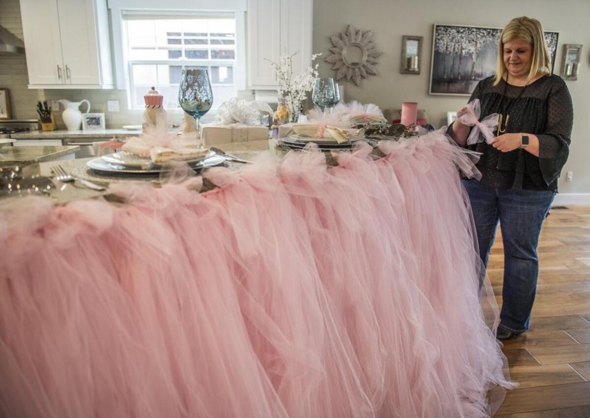 Interior designer Elizabeth Lake decorates the Mirell home with a “Nutcracker” theme in East Sacramento in preparation for the Sacred Heart Holiday Home Tour Dec. 1, 2 and 3. She hand-tied 7,000 feet of pink tulle into a massive tutu-like skirt that rings the granite countertop. “It took 40 hours to do,” Lake said. “But it was totally worth it.”