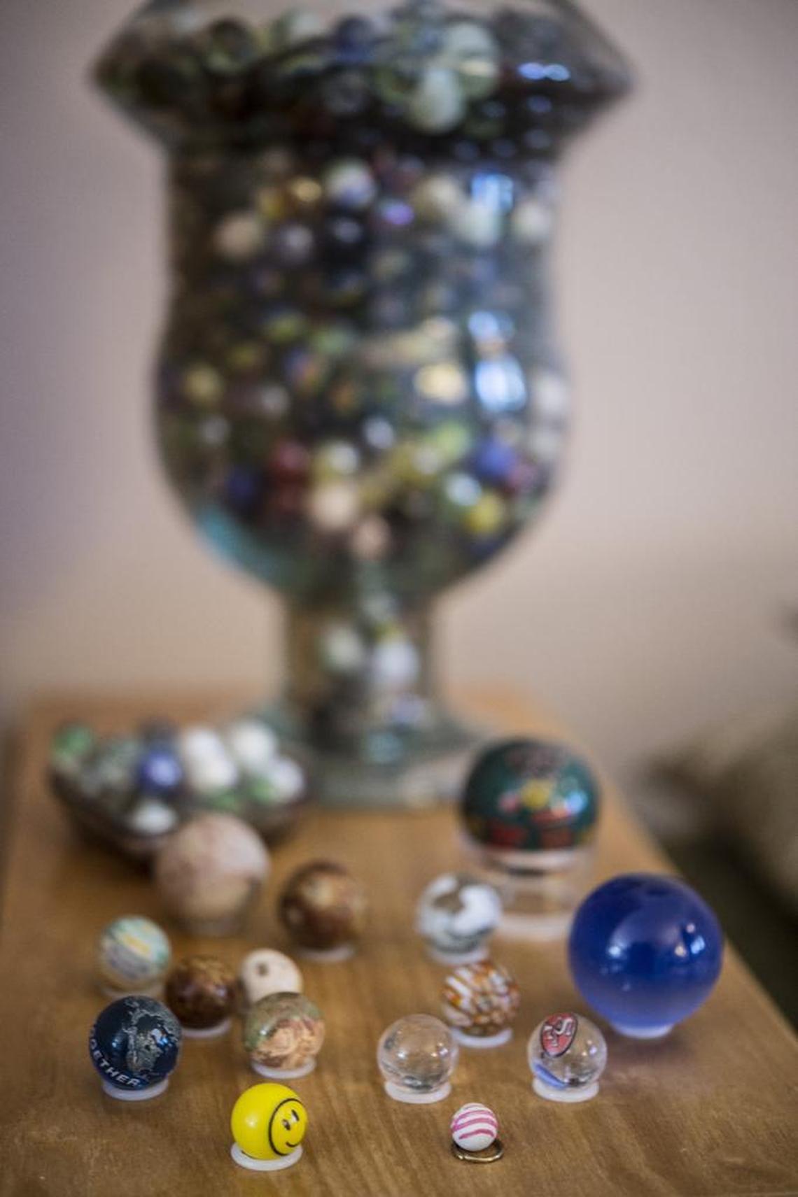 Judy Headley’s smallest marble is among one with a smiley face and two 49er marbles.