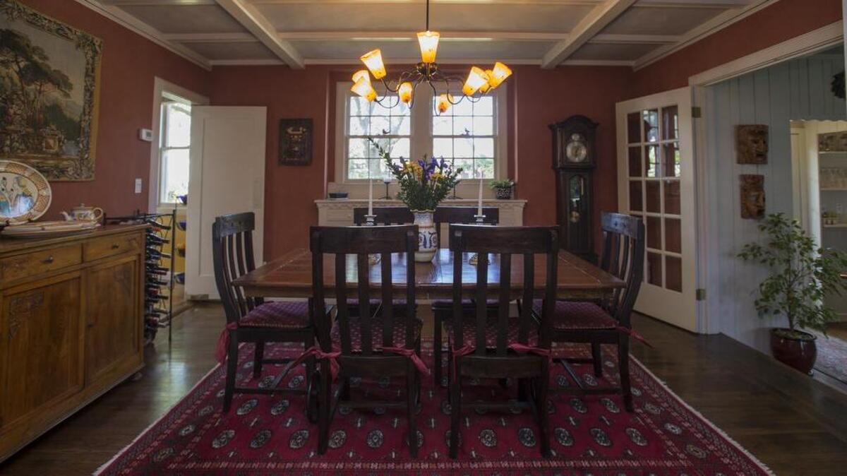 The home includes a formal dining room, above, and a sunken living room. “What I like best about the house is the character, the history and the neighborhood,” Zacaroli said.