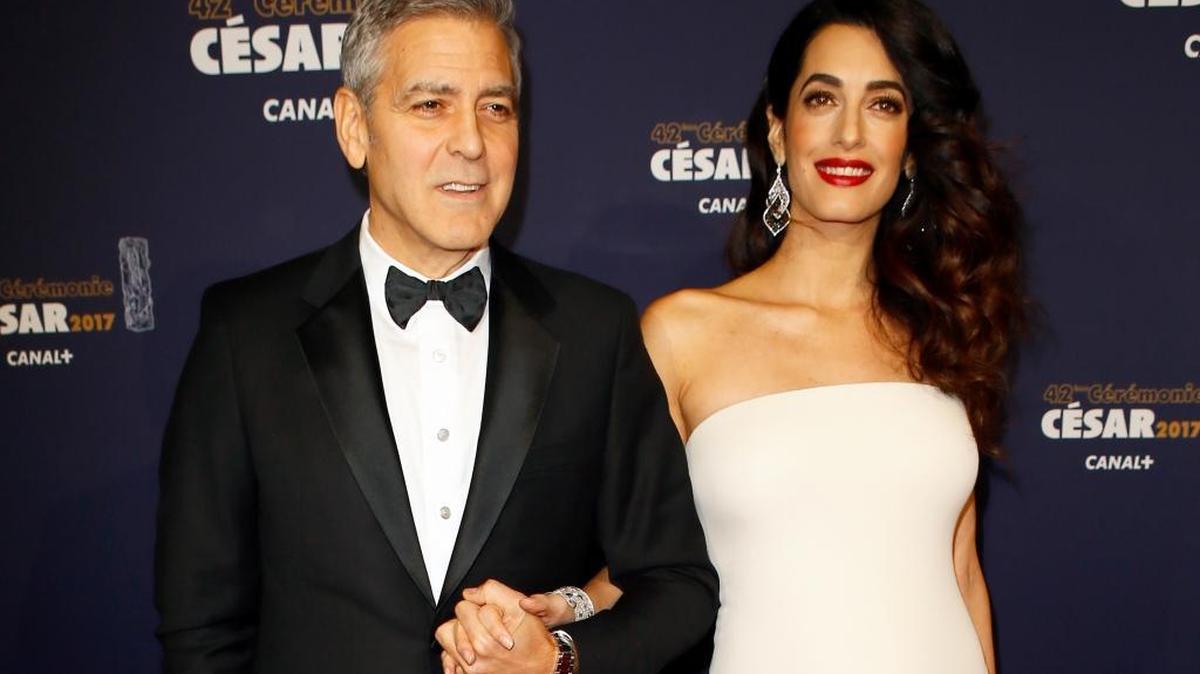 Actor George Clooney and Amal Clooney arrive at the 42nd annual Cesar Film Awards ceremony at Salle Pleyel in Paris in February. The Clooneys donated $10,000 to 10-year-old Camp Cocker Rescue of Los Angeles after the nonprofit took in nine dogs from a backyard breeder.