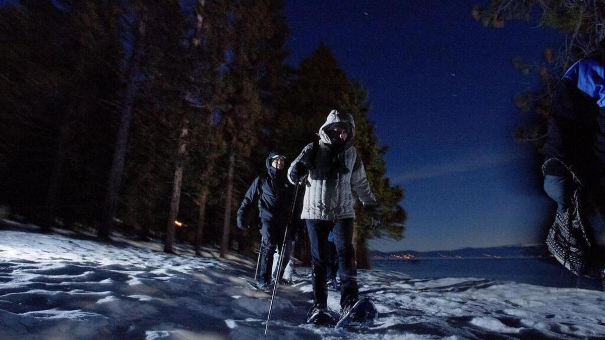 Snowshoers negotiate the Lake Tahoe shoreline at Sugar Pine Point.