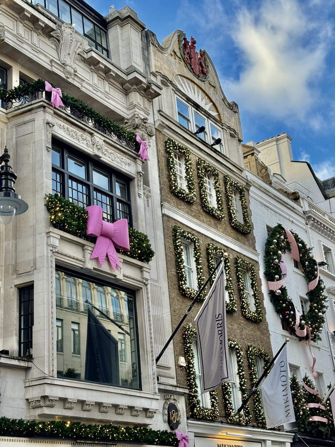 Bond Street draped in oversized bows and sparkling storefront décor.