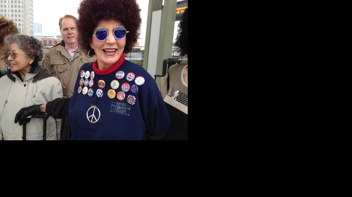 
Peggy Hauser of Roseville is a Reno Fun Train regular. She shows off her buttons from previous trips as she waits at the Sacramento Amtrak station.
